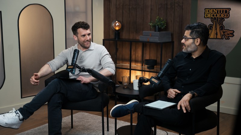 Podcast hosts talking during a recording session